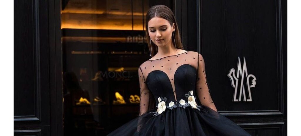 Black tulle cocktail dress with sweetheart neckline and flower embroidery.